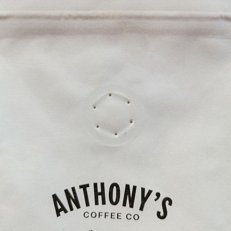 Close view of the exterior valve above black brand text
