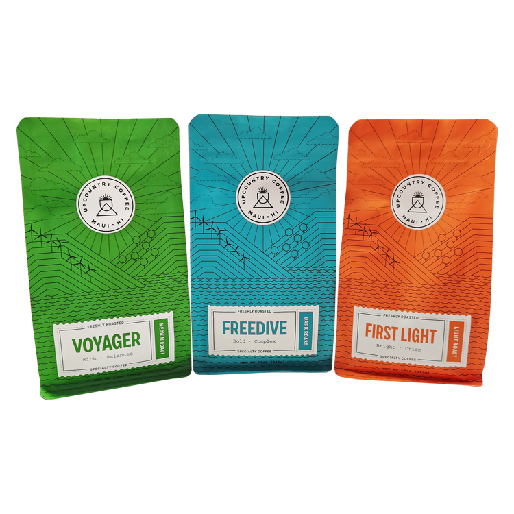 Green turquoise and orange coffee bags displayed side by side