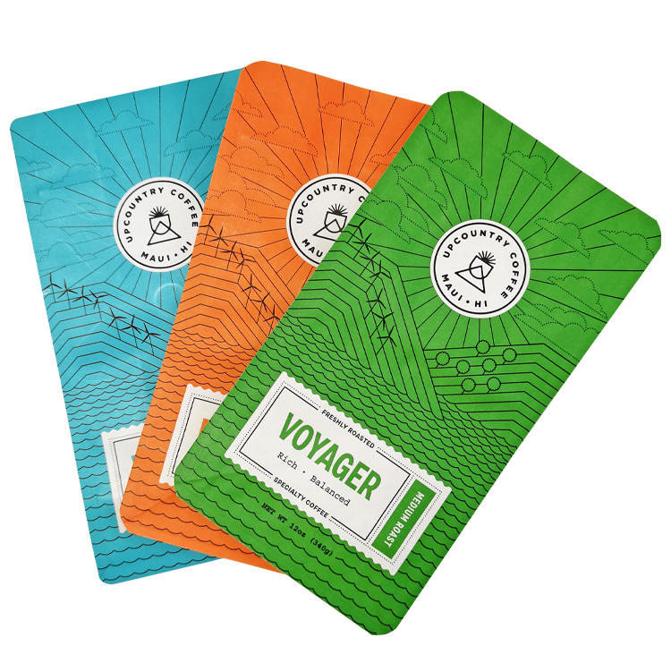 Overlapping turquoise orange and green coffee bag fronts