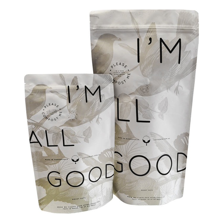 Several white coffee pouches with large black letter graphics