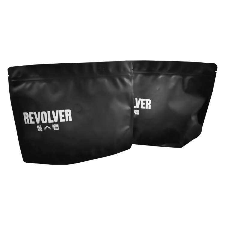Two black stand up coffee pouches with white graphics
