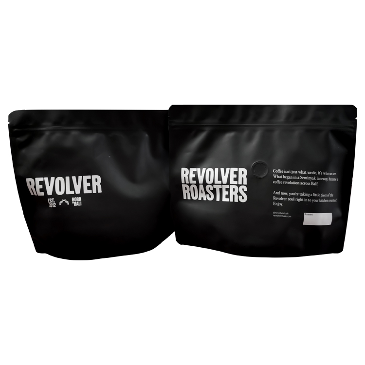 Front and back of black coffee pouches with white printed artwork