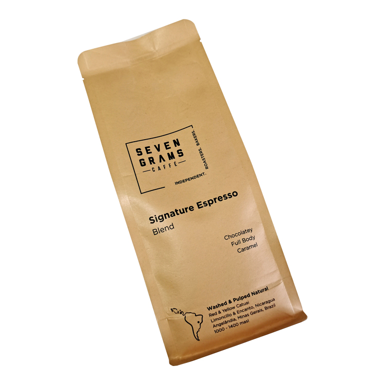 Angled front of a kraft-colored coffee bag with black printed information