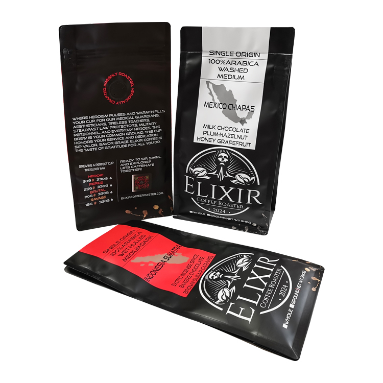 Front and back views of black coffee bags with white and red printed labels