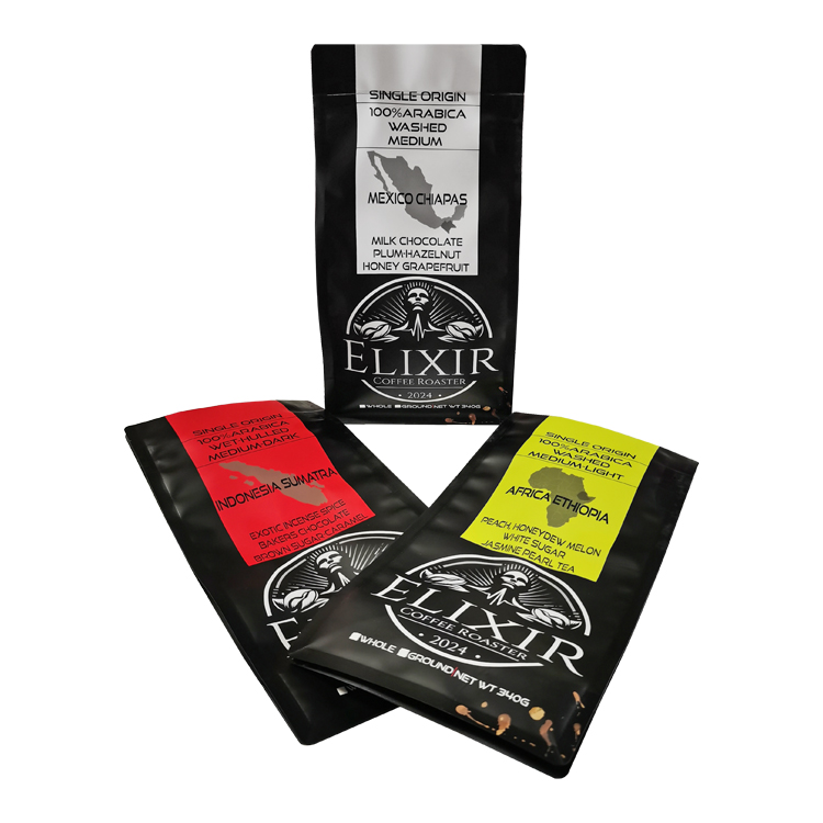 Black flat bottom coffee bags with red, yellow and white label panels