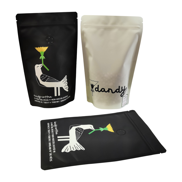 Black and cream printed stand up coffee pouches with bird artwork