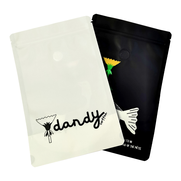 Pale and black coffee pouches laid side by side