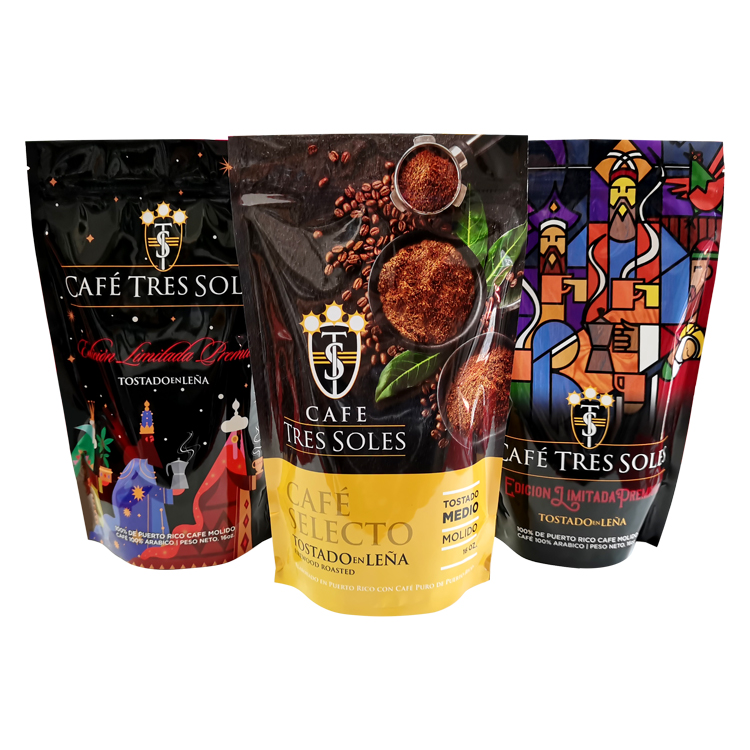 Three printed stand up coffee pouches with colorful illustrations