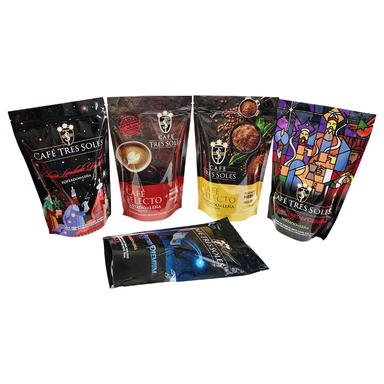Four upright coffee pouch designs beside a laid-down dark version