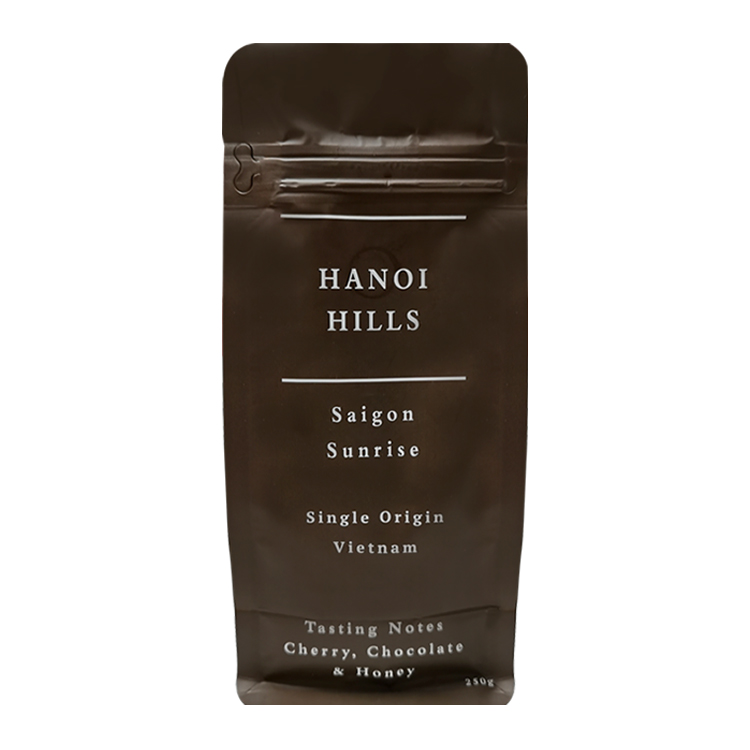 Brown flat bottom coffee bag with a printed product label