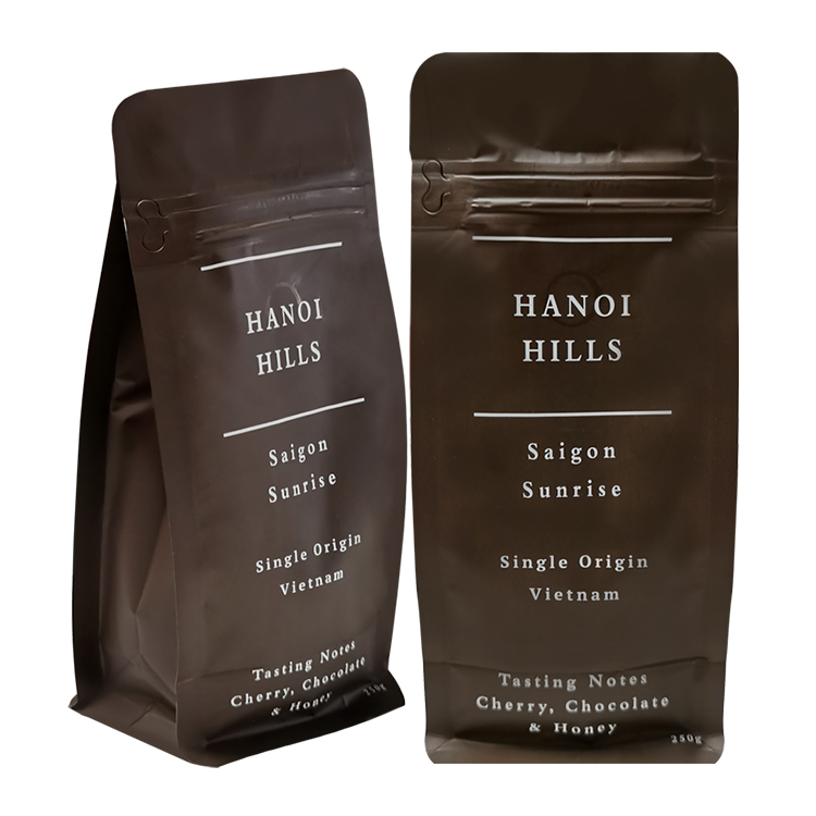 Angled and straight front views of two dark brown coffee bags