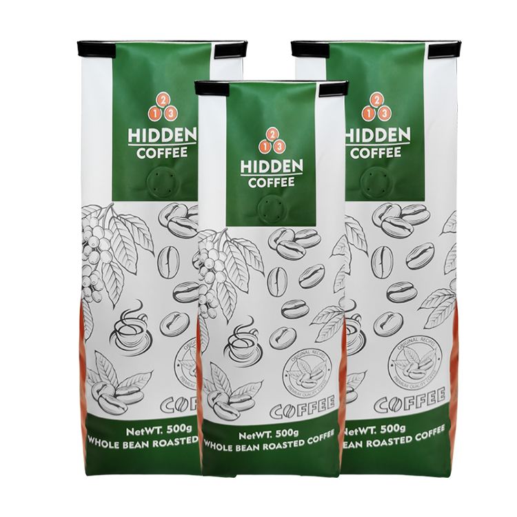 Three green and white coffee bags with botanical line drawings, printed text and black clips at the top