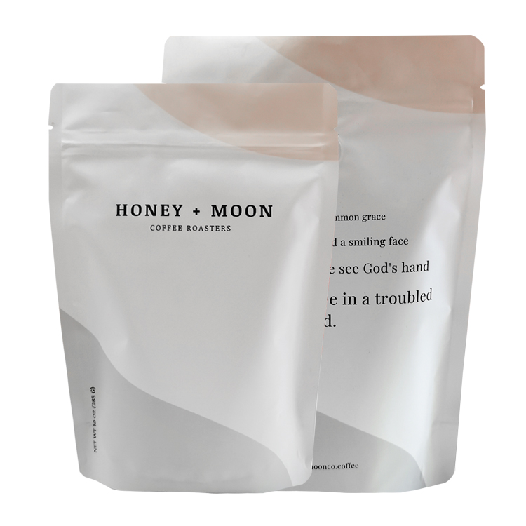 Printed stand up coffee pouches from a 10 oz project shown from the front and back