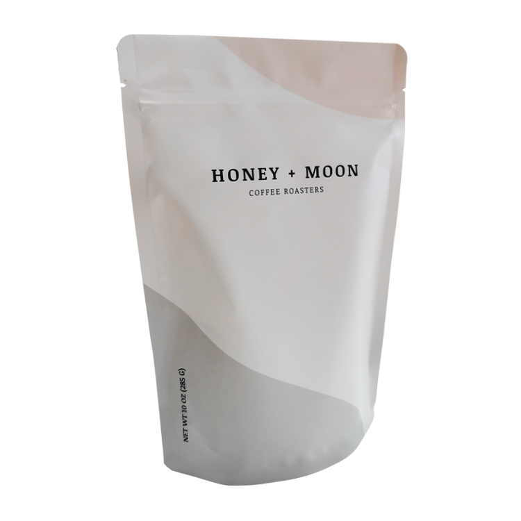 Angled front of a pale coffee pouch with curved color shapes