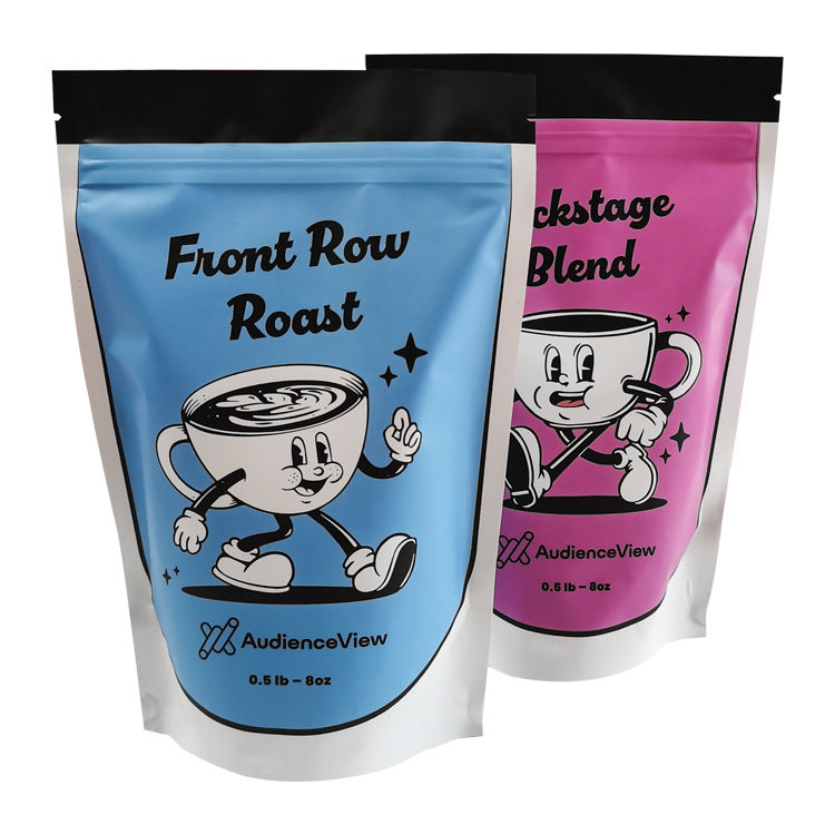 Two upright cartoon coffee pouches with blue and pink fronts