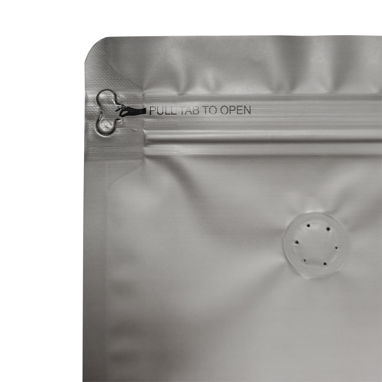 Close view of pull-tab instruction zipper area and valve