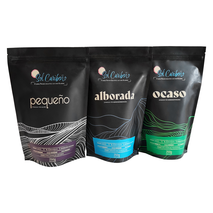 Three black printed coffee pouches with line artwork and colored label panels