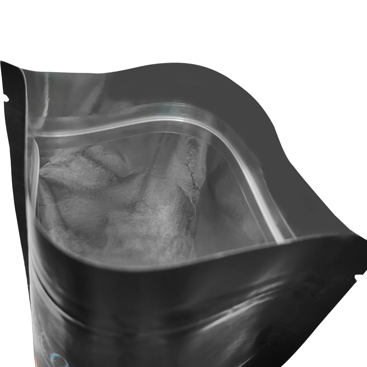 Open dark pouch showing its pale inner closure area