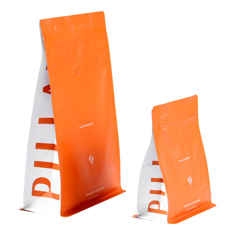 Narrow side views of two orange bags with white side lettering