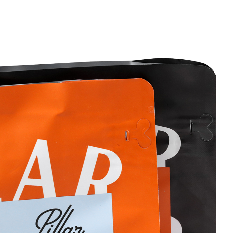 Close view of black and orange upper panels and opening tabs