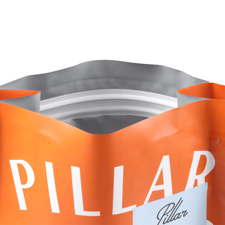 Open orange coffee bag with white lettering and inner closure