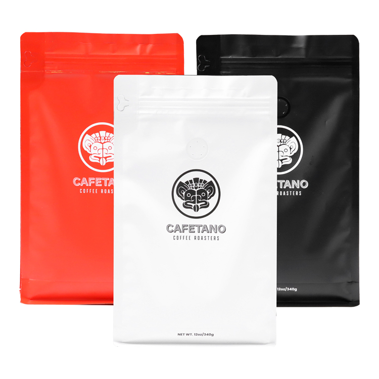 Red, white and black coffee bags with round printed brand marks