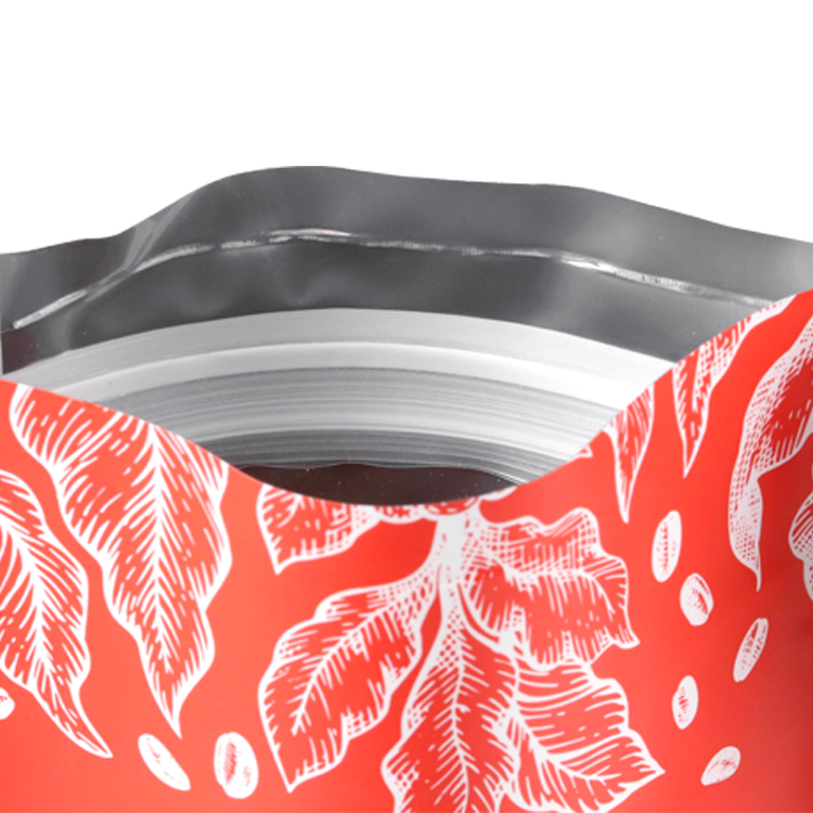 Open red coffee bag showing its inner closure