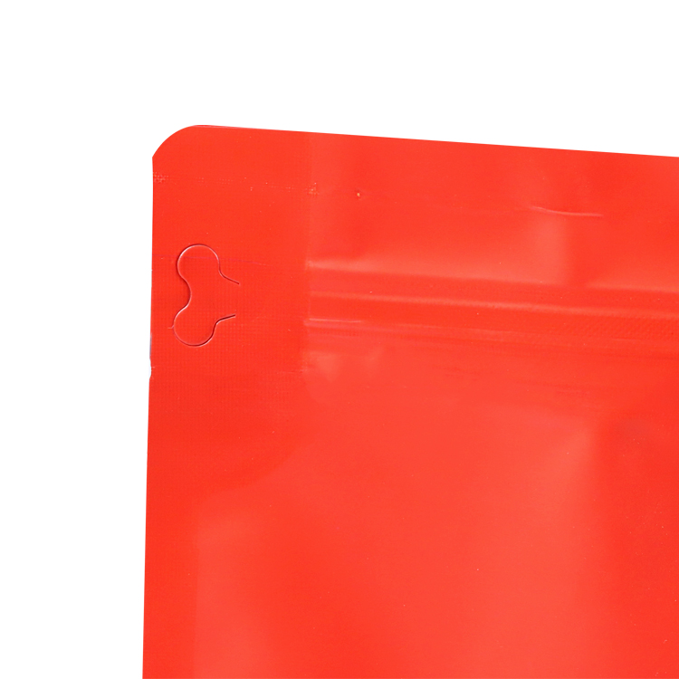 Close view of the side opening tab on a red upper panel