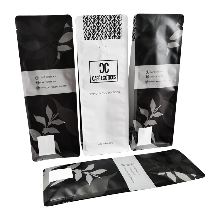 Three upright coffee bag views beside a laid-down dark panel
