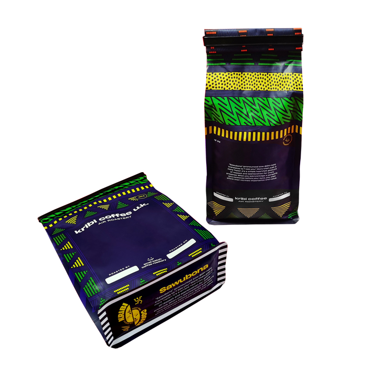 Tall patterned coffee bag beside a laid-down shorter bag