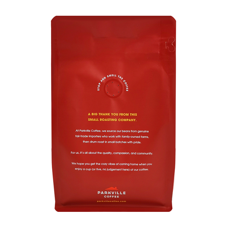Back of a red coffee bag with a visible valve and small text
