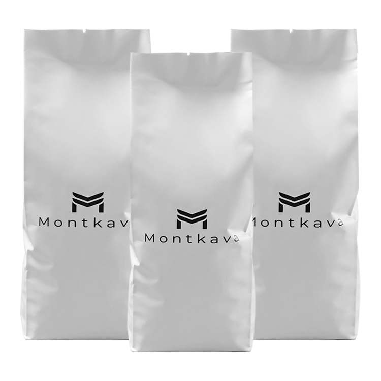 Three white coffee bags with the same small black front mark