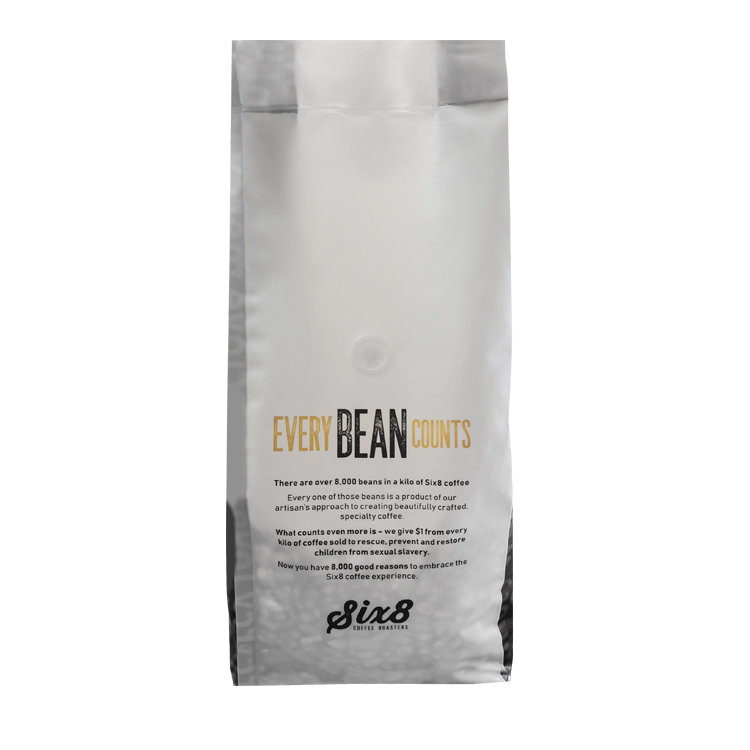 Printed side gusset coffee bag showing a text panel and visible valve