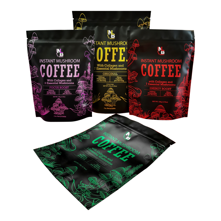 Upright colored mushroom coffee pouches beside a laid-down green version