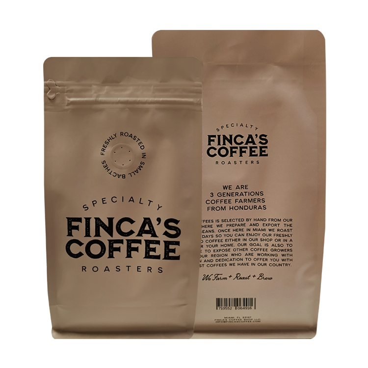 Front and back views of beige printed coffee bags with black lettering