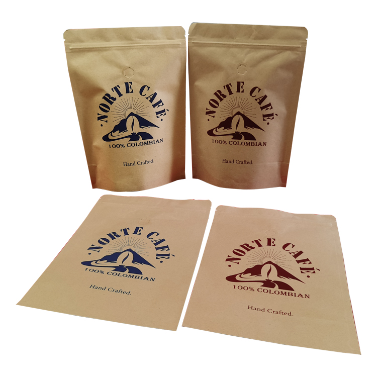 Two upright and two laid-down kraft-colored coffee bags