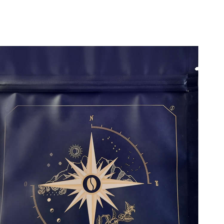 Close view of gold-colored compass artwork below the top area