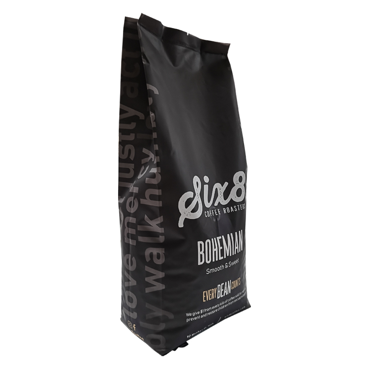 Angled dark coffee bag showing large side lettering