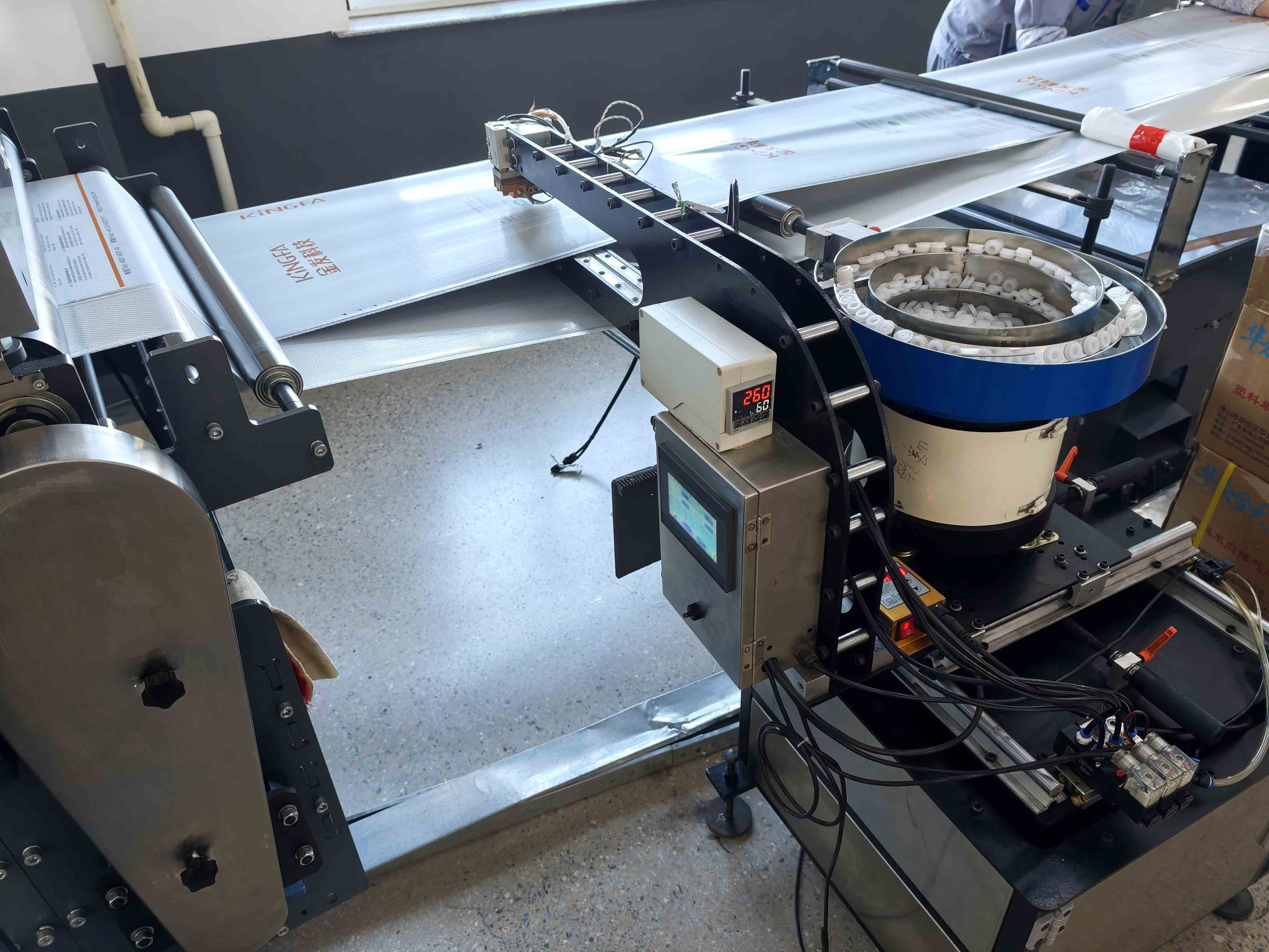 Valve application equipment with a bowl of white components, film handling rollers and control displays