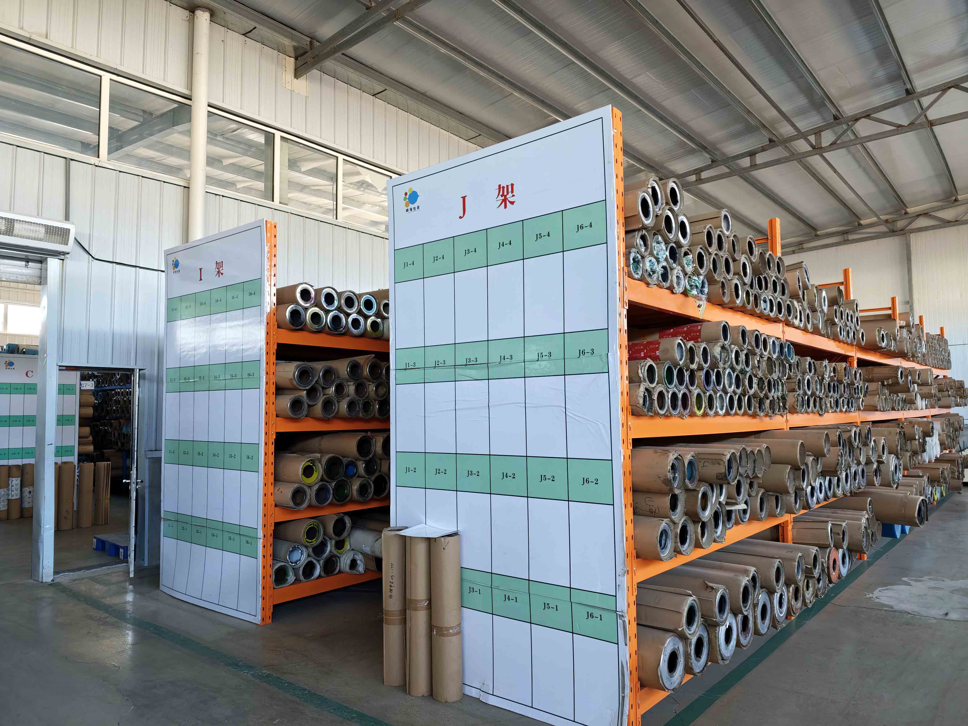 Gravure printing cylinders stored on labeled racks