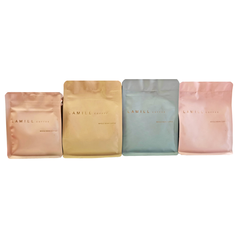 Four pastel coffee pouches with their front panels and top closure areas visible